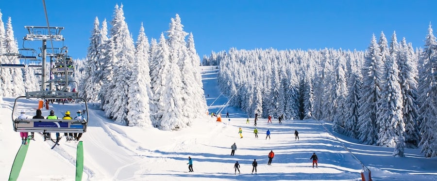 Mountain Ski Resort Full Of People Going Downhill